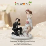 Celebrate Your Eternal Love Story Commemorate the magic of your special day with the Romantic Wedding Couple Figurine by The Gift Tree. This exquisitely detailed sculpture is designed to "Capture Your Moment," serving as a timeless reminder of the love and commitment shared between two souls. Key Features: Artistic 3D Design: Features a charming scene of a groom in a classic black tuxedo capturing a photo of his beautiful bride in a high-low lace wedding gown. Heartfelt Sentiments: The base is elegantly inscribed with "I ❤️ You" and delicate pink heart accents, making it a truly "Romantic" keepsake. Exquisite Detailing: From the bride’s pink floral headpiece and matching bouquet to the groom’s realistic camera, every element is meticulously crafted. Perfect for Anniversaries & Weddings: This figurine is the "Perfect Gift for Anniversaries & Weddings," offering a unique alternative to traditional presents. Premium Decor Piece: Set on a clean white oval base, it adds a touch of elegance to your mantel, bedside table, or display cabinet.